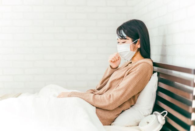 体調不良の女性